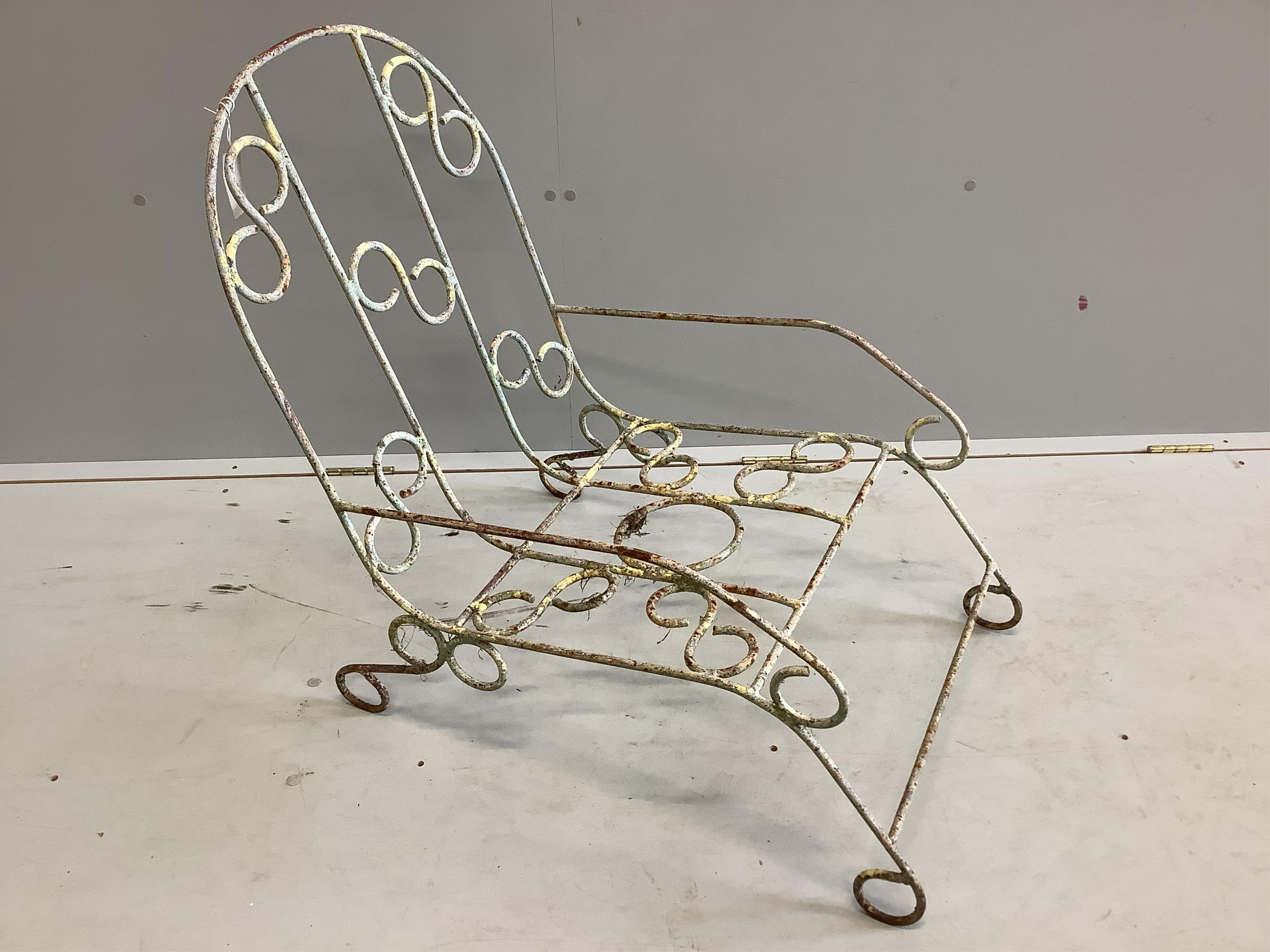 A vintage French wrought iron garden chair, width 48cm, depth 74cm, height 76cm. Condition - fair